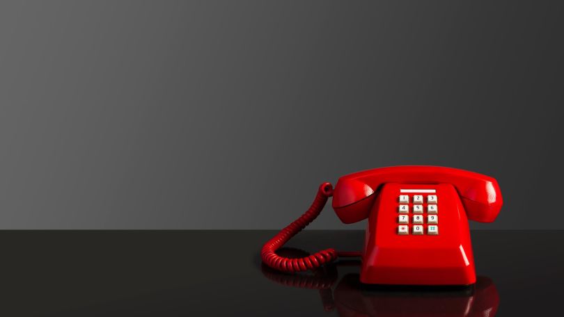 A red phone is pictured.