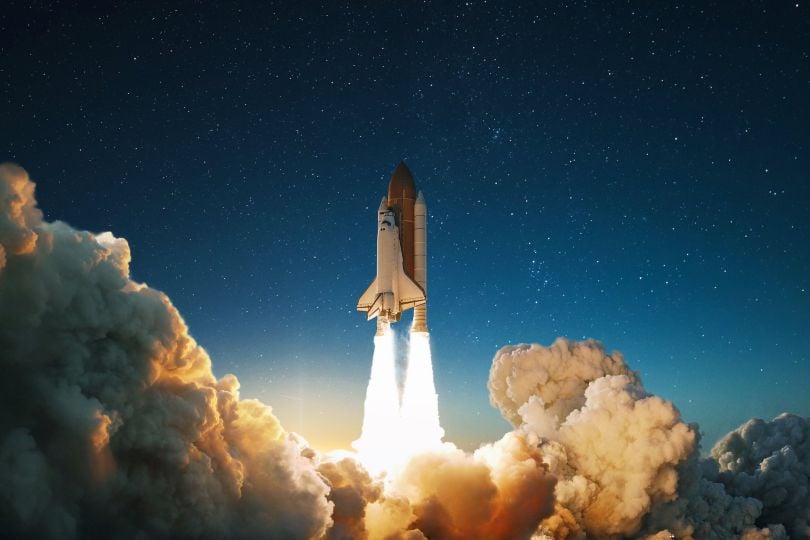 A rocket is shown taking flight.