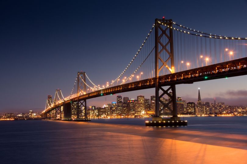 A photo of the Golden Gate Bridge at night is shown.