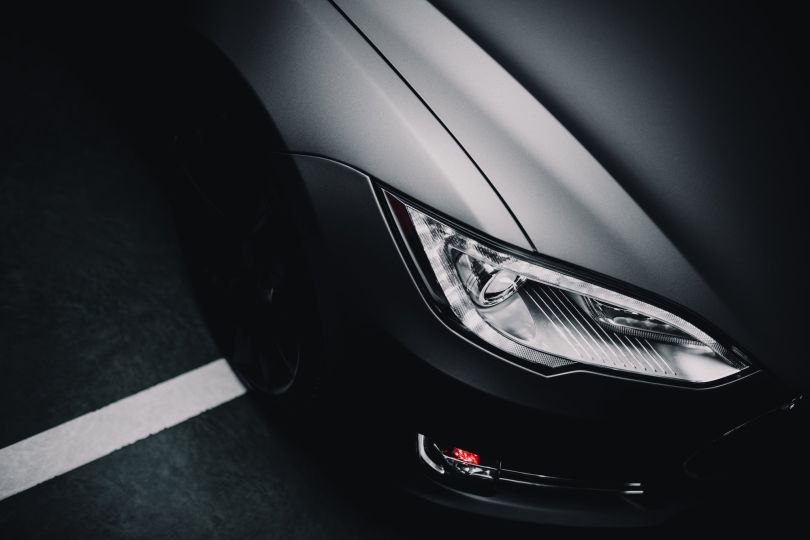 Part of a gray car is shown.