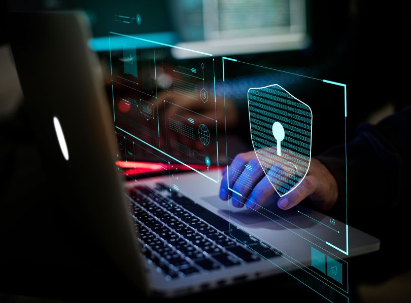 Keyboard with blue digital lock to represent cybersecurity 