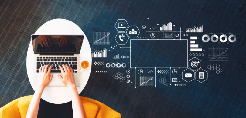 A computer with illustrations of actionable marketing data beside it.&nbsp;