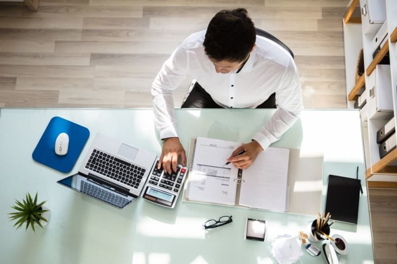 Compliance professional working at desk