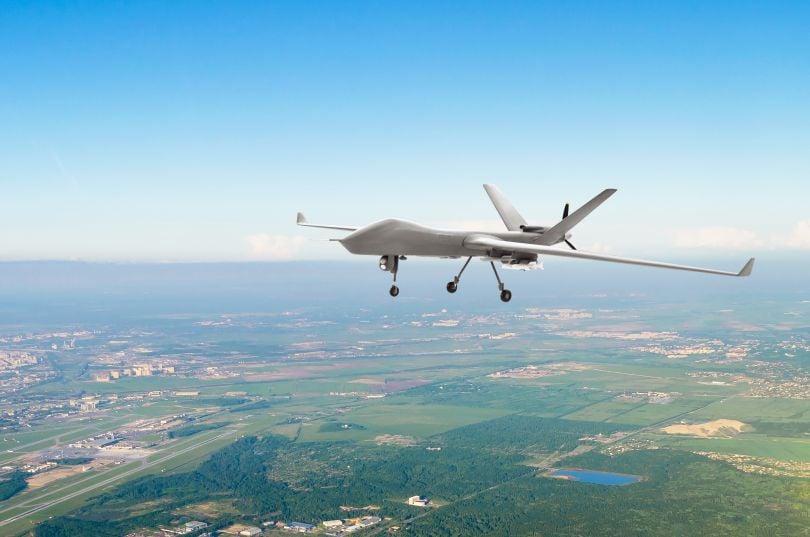 A military drone flying in the sky
