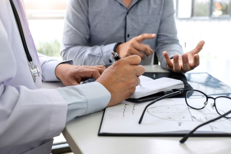 Doctor and patient speaking in an office