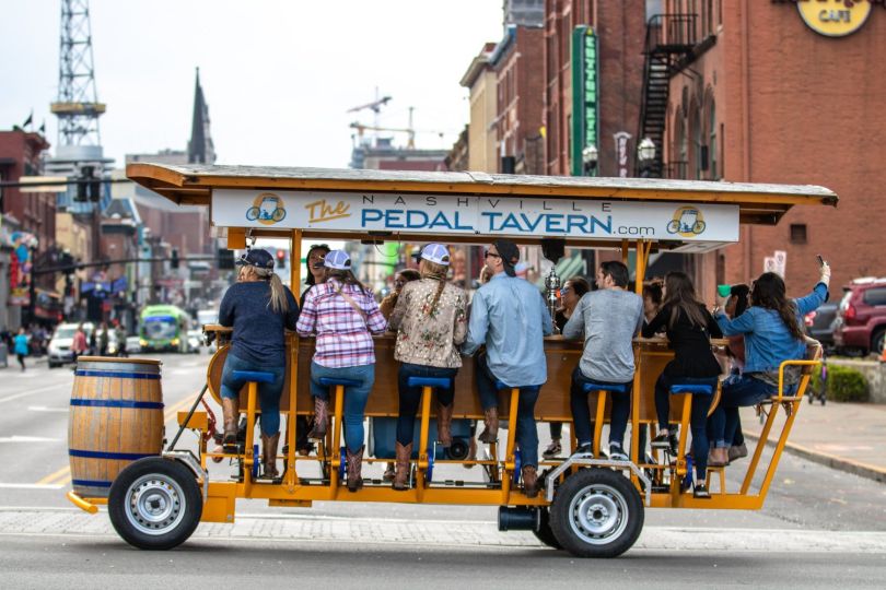 A Pedal Tavern party bike traverses the streets of Nashville.