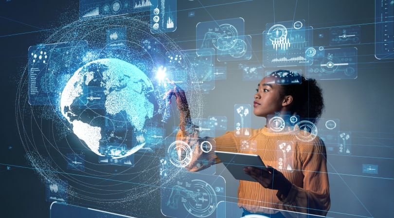 A woman interacts with a modern touch screen. 