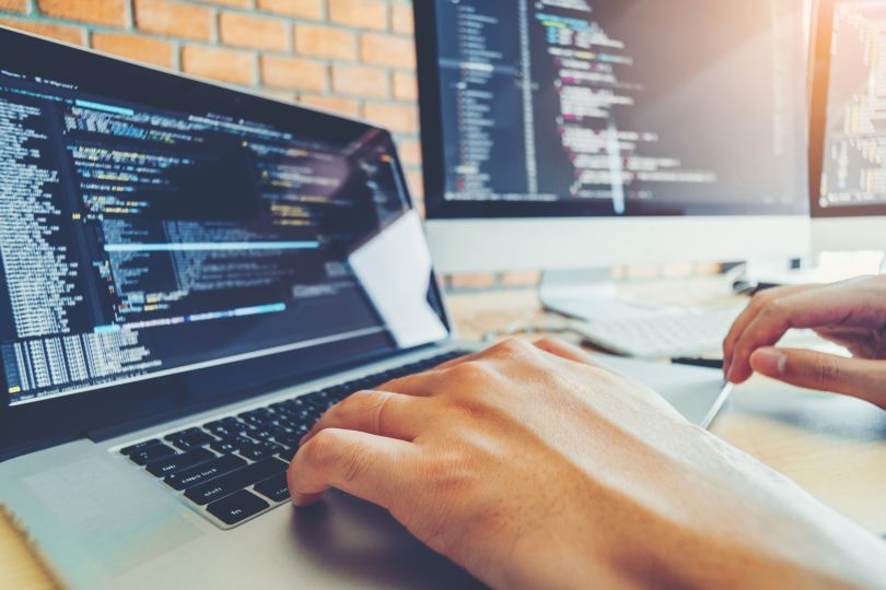 Developing programmer working on software.