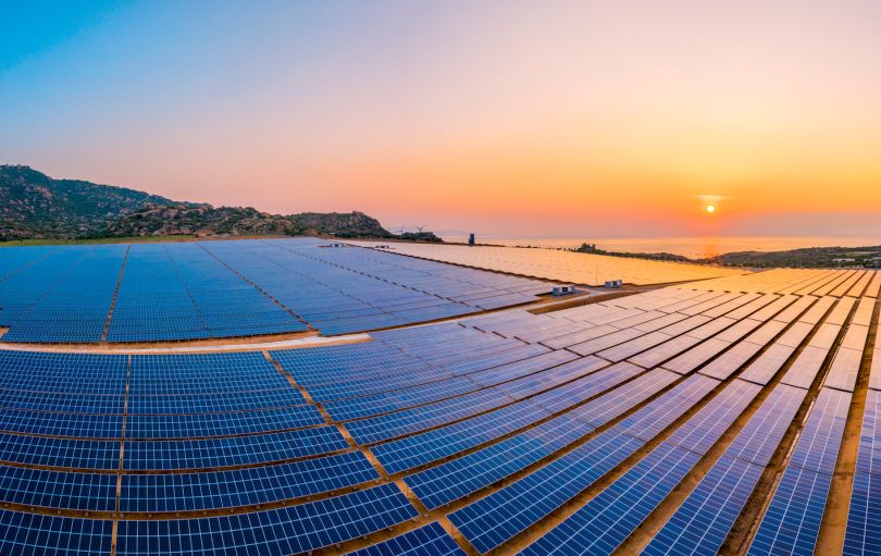 A field of solar panels is pictured.