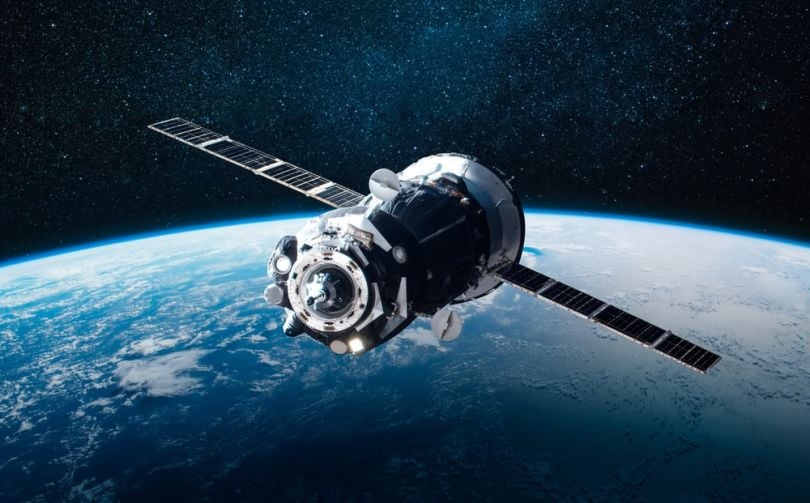A satellite in space above Earth.