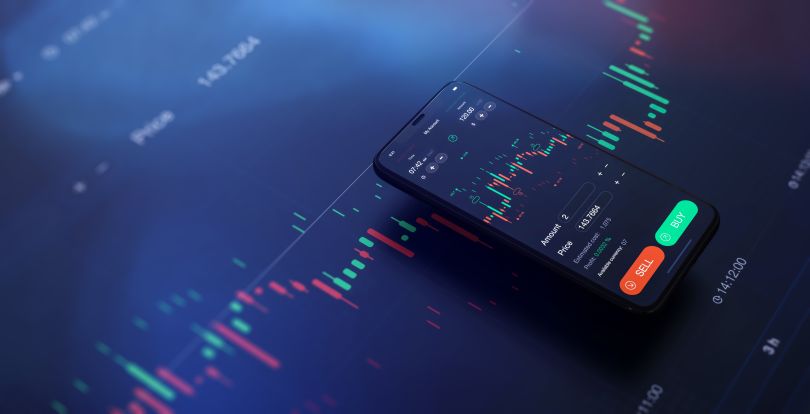 A smart phone shows stock trading buy and sell options.