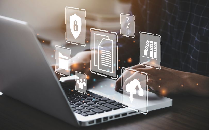 A depiction of data as a person uses a laptop.