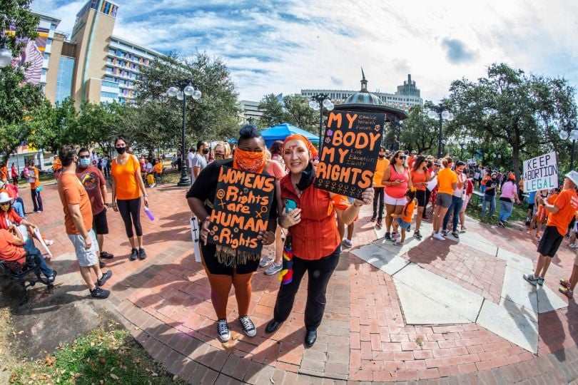 Protestors hold signs condemning Texas' new abortion law at a rally in San Antonio.