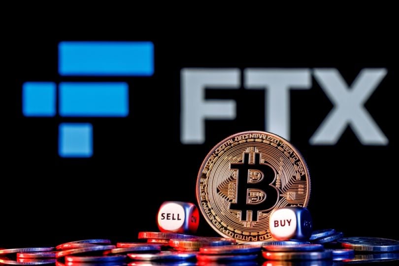 FTX logo behind a Bitcoin icon