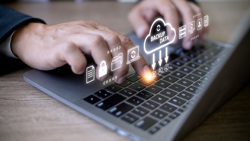 Businessperson uses backup storage on his computer