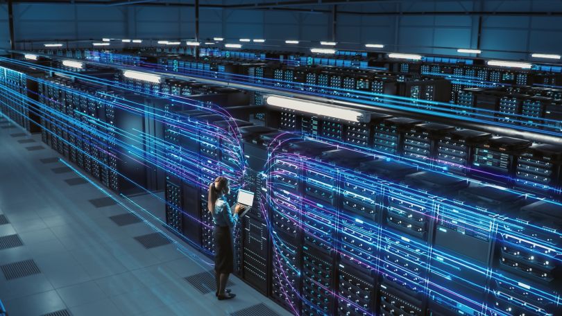 An employee works in a data center.