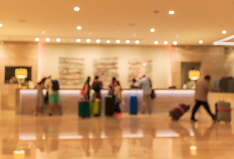 A blurry image of a hotel check-in counter