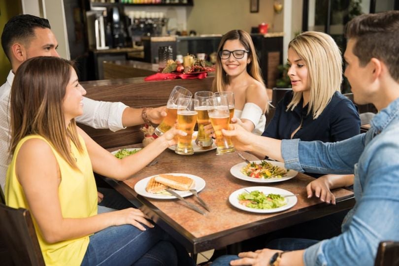 Friends toasting at dinner