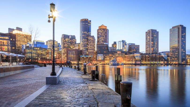 A panoramic view of the Boston harbor at night.