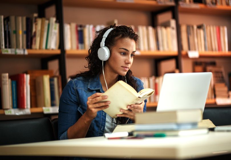 A woman studying on her laptop.