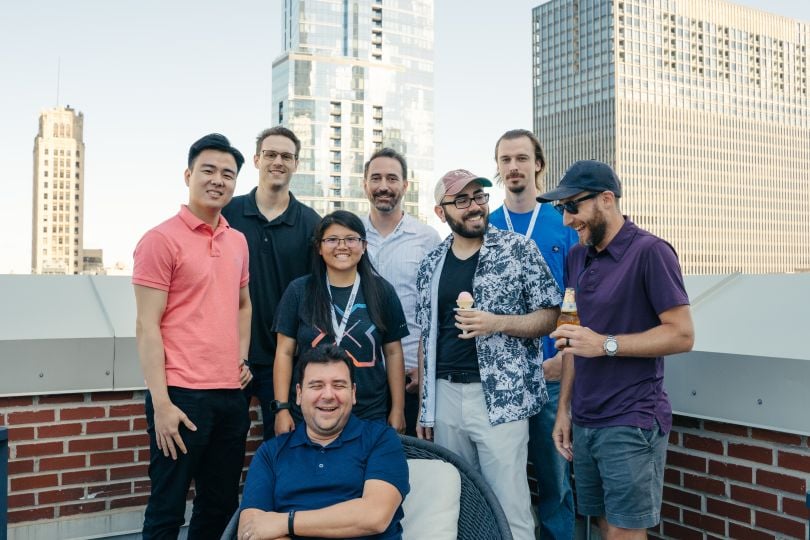 Members of Snapsheet hanging out on a rooftop.