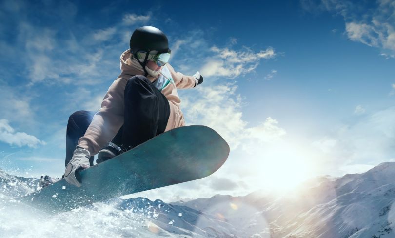 A snowboarder in action is shown.