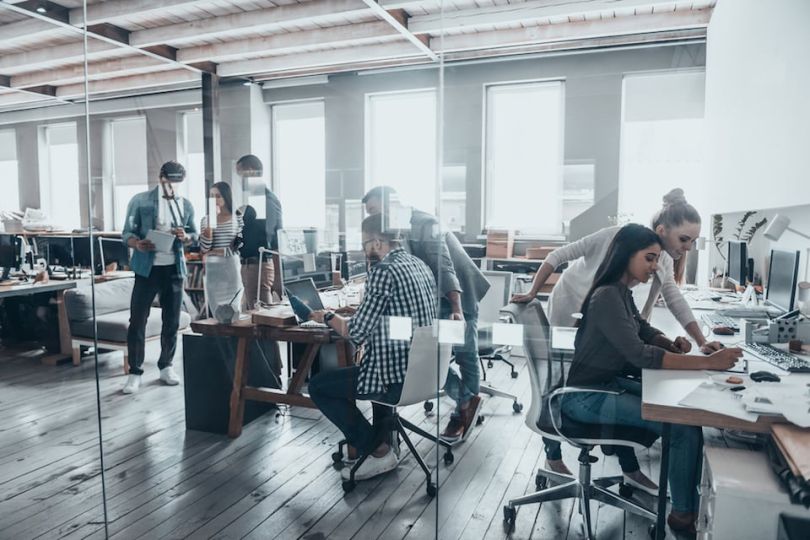 tech startup employees collaborating 