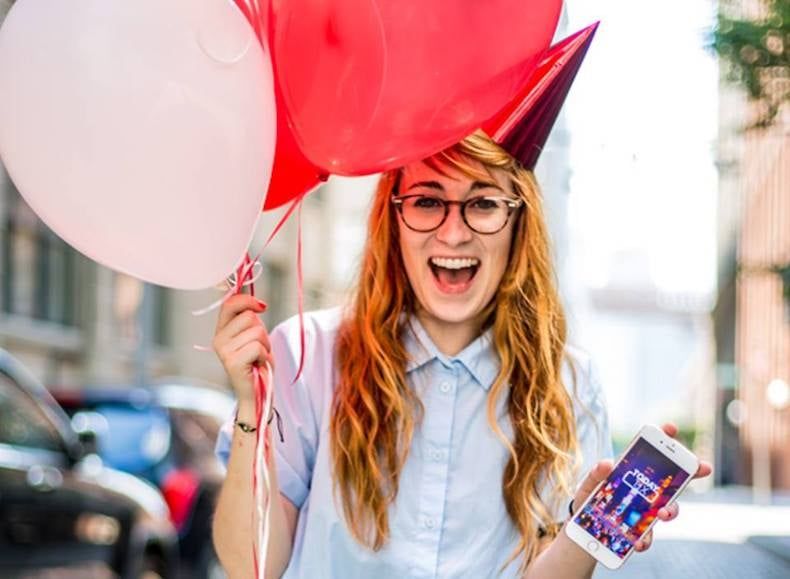 Woman holding balloons