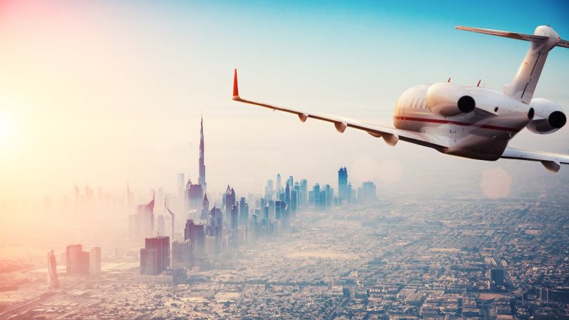 A flying plane is pictured.