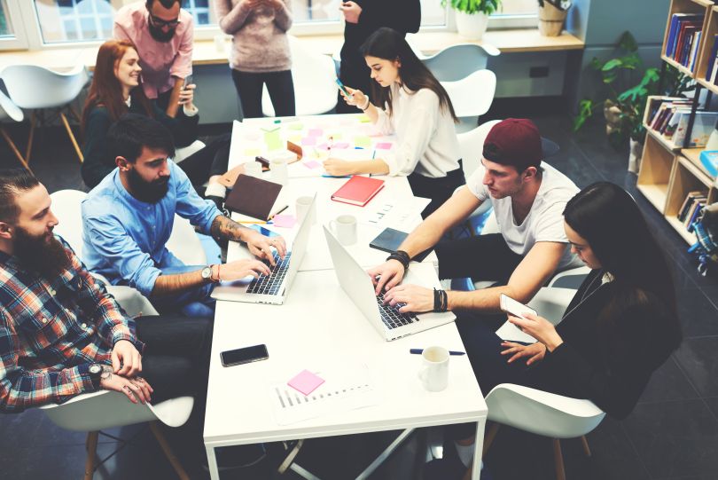 Image of a software development team working together 
