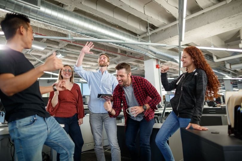 VelocityEHS team members enthusiastically celebrate a shared achievement.&nbsp;