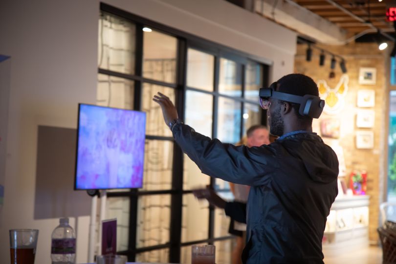  A Wipfli employee interacts with a VR headset.