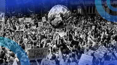 An environmental rally with a huge globe in the middle